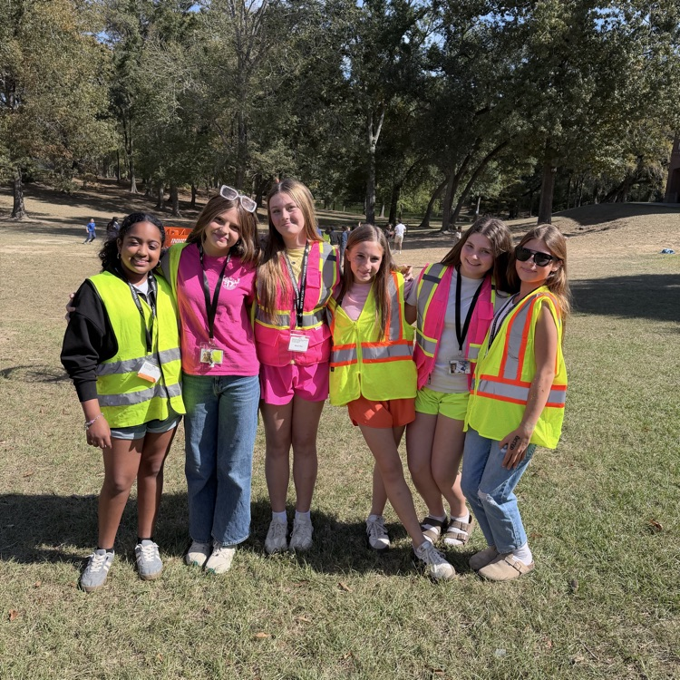 Students dress as construction workers and traffics cones in celebration of pit crew day for homecoming week