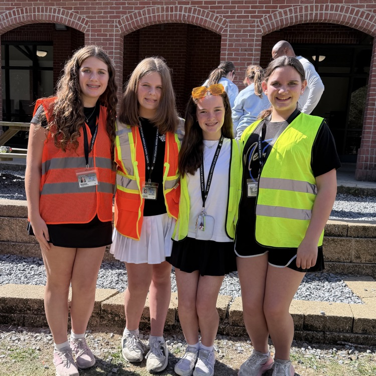 Students dress as construction workers and traffics cones in celebration of pit crew day for homecoming week