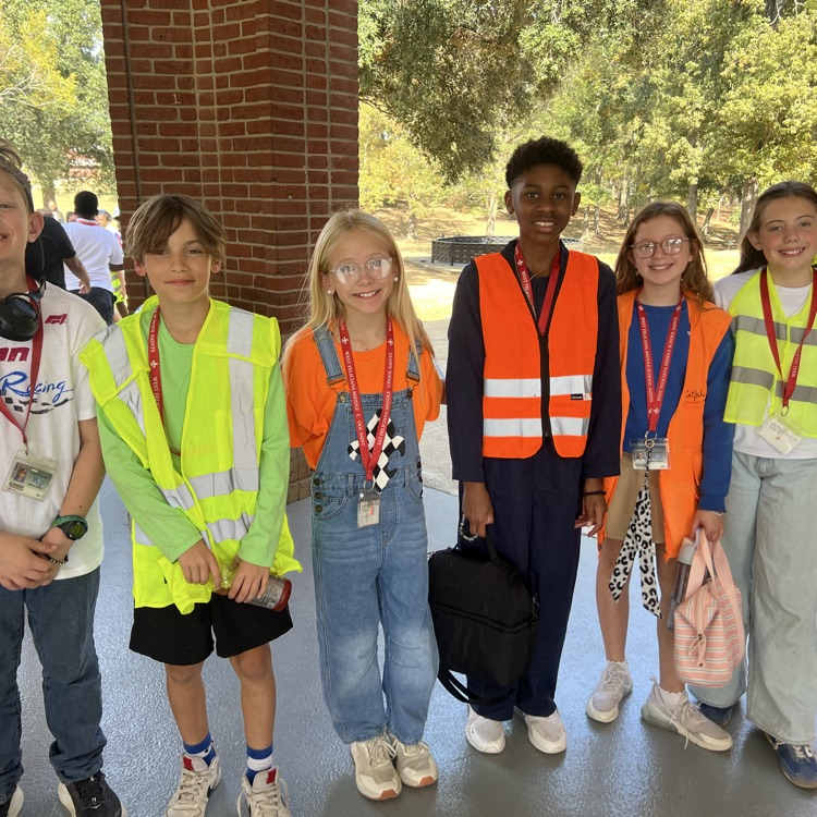 Students dress as construction workers and traffics cones in celebration of pit crew day for homecoming week