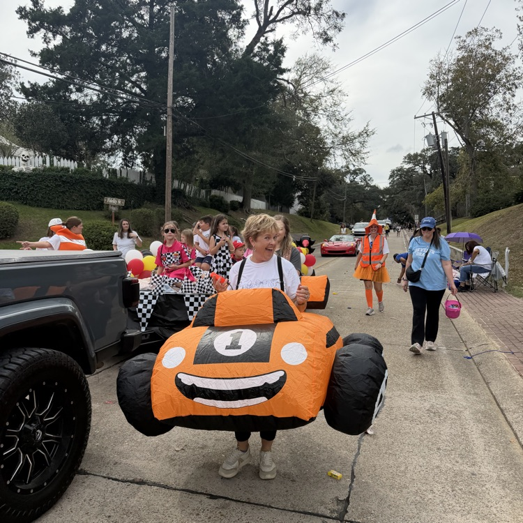 Students and staff ride in parade