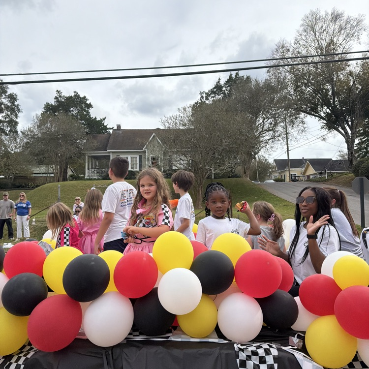 Students and staff ride in parade