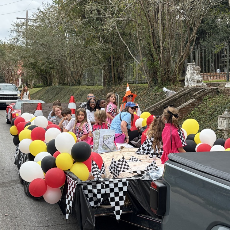 Students and staff ride in parade