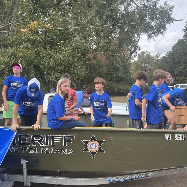 Students and staff ride in parade