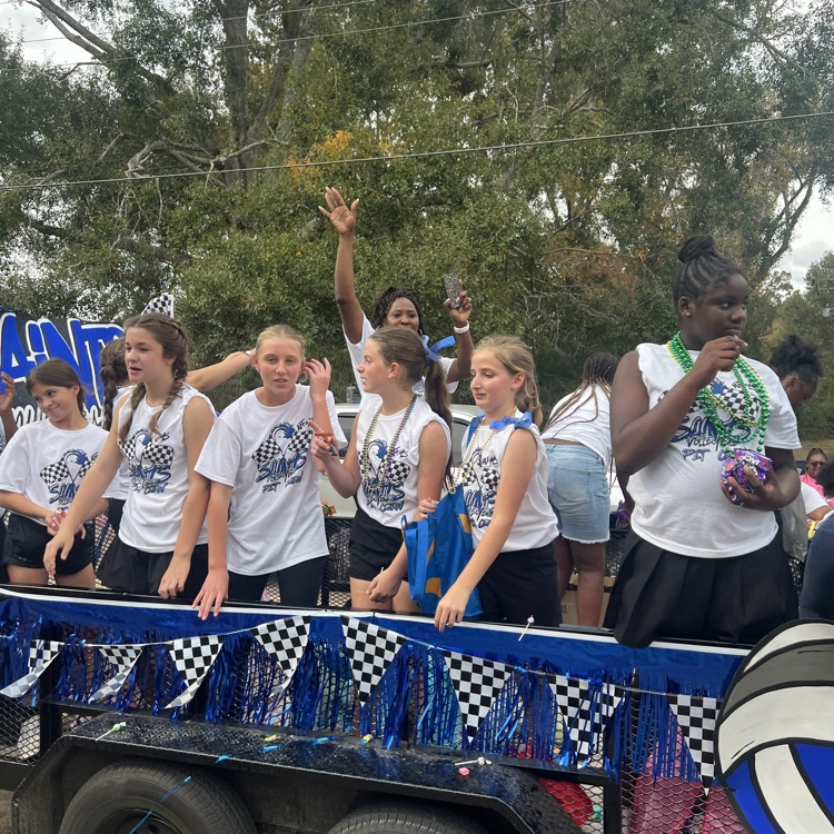 Students and staff ride in parade