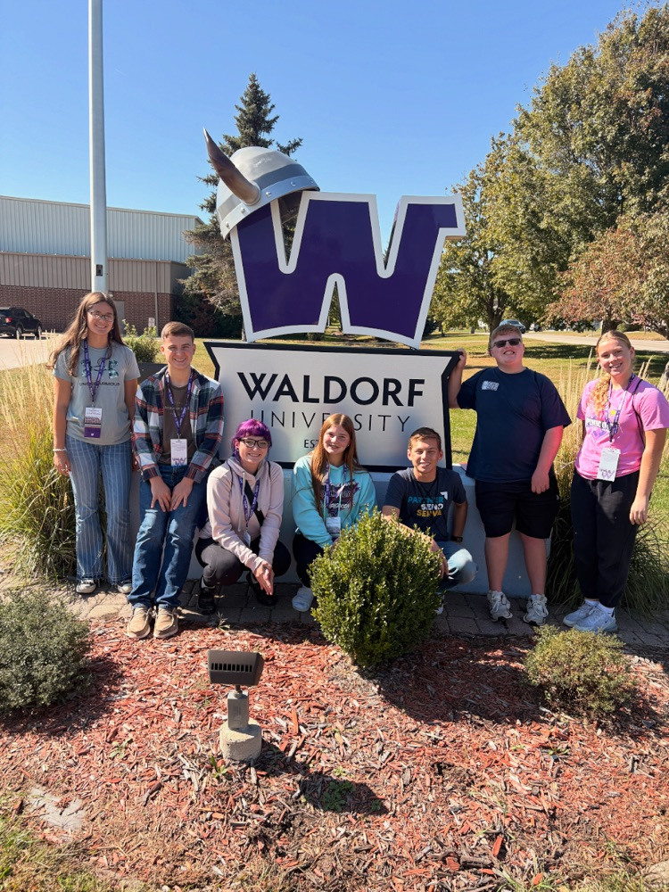 Autumn, Irena, Ashton, Slater, Keyahna, Bryce, Geneviene infront of the Waldorf campus sign 
