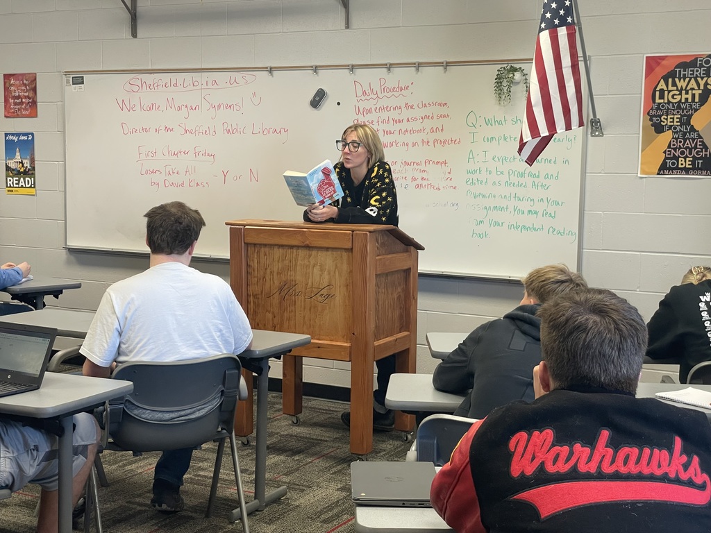 Librarian reading to students.