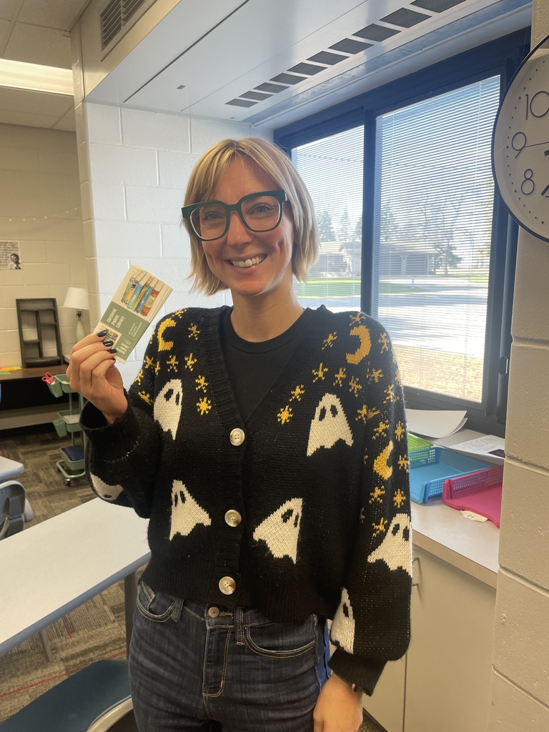 Librarian holding library cards.