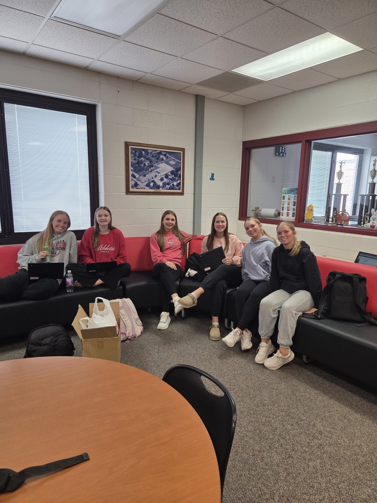 Students on red and black couches