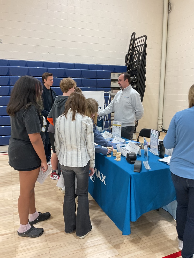 Students at career day table