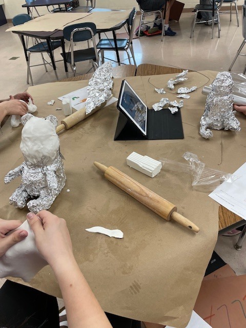 Students creating their clay projects