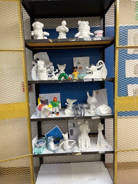 Student artwork on the shelf