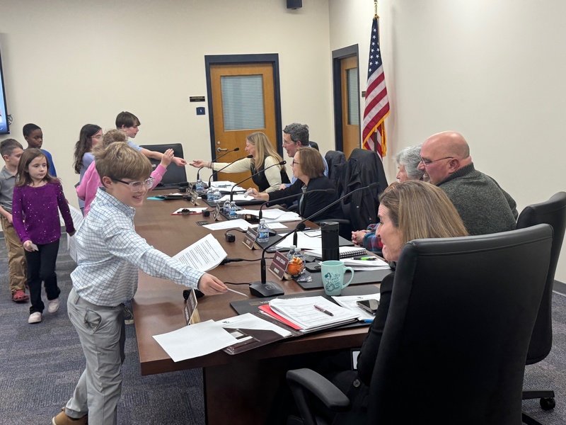 Students handing out Gotcha stickers