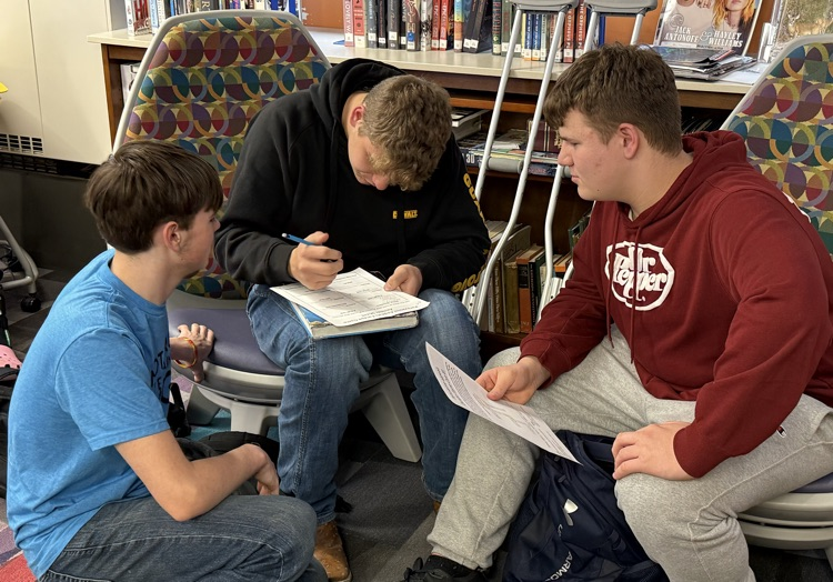 Three students working together 
