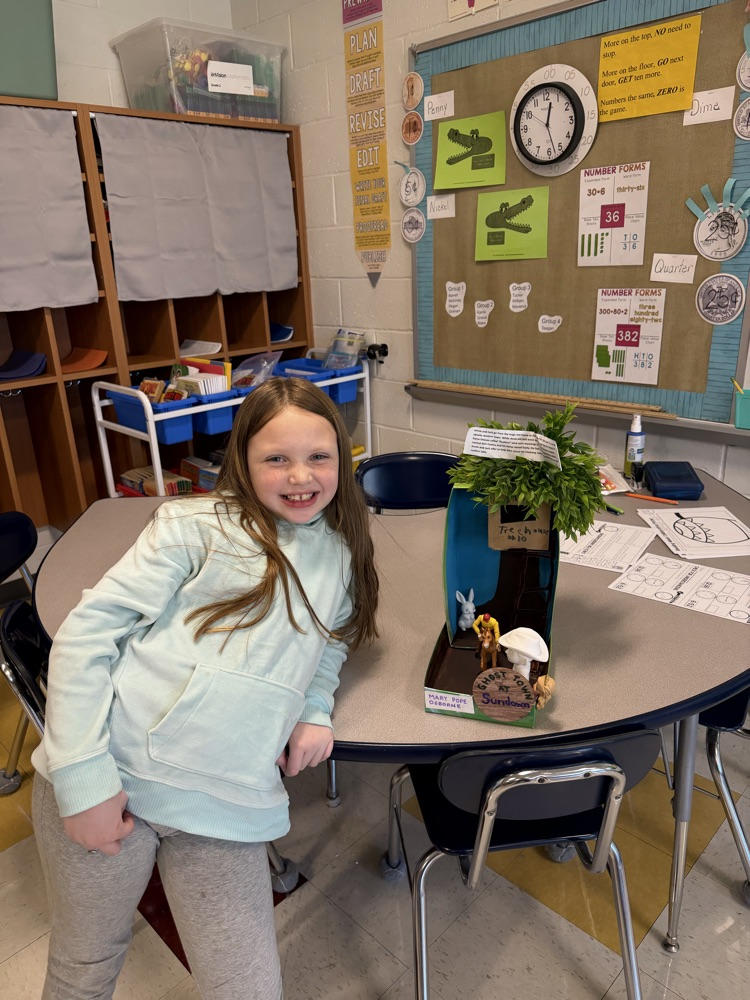 Student showing book project .