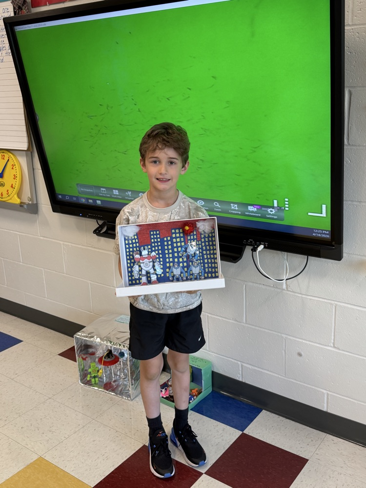 Student showing book project .