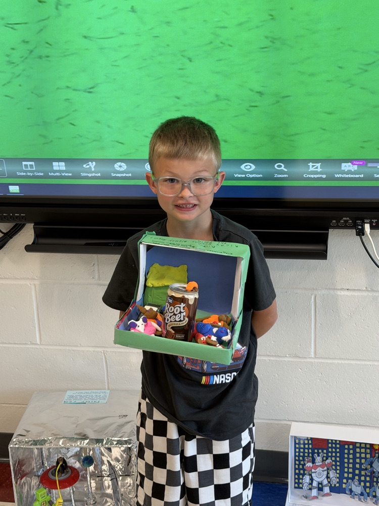 Student showing book project .