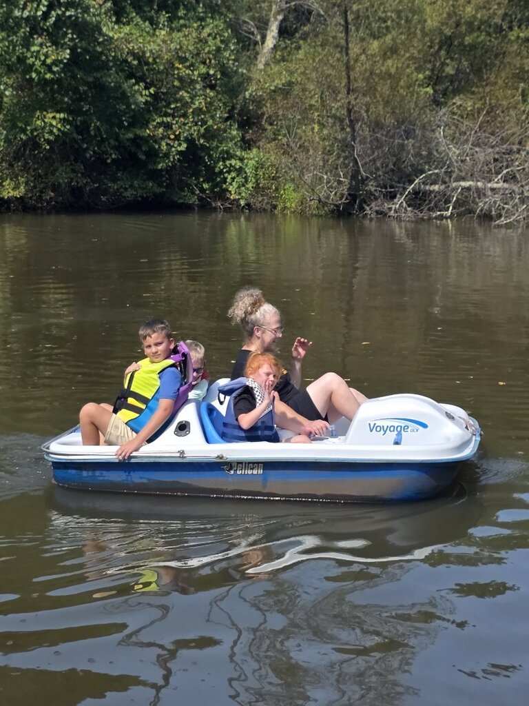 Students in Mrs. Rohrer's classroom enjoy riding a paddle boat at Blessed Valley Lodging.