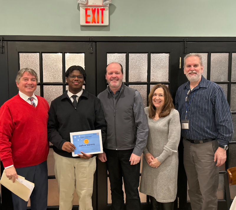 Joshua accepting award