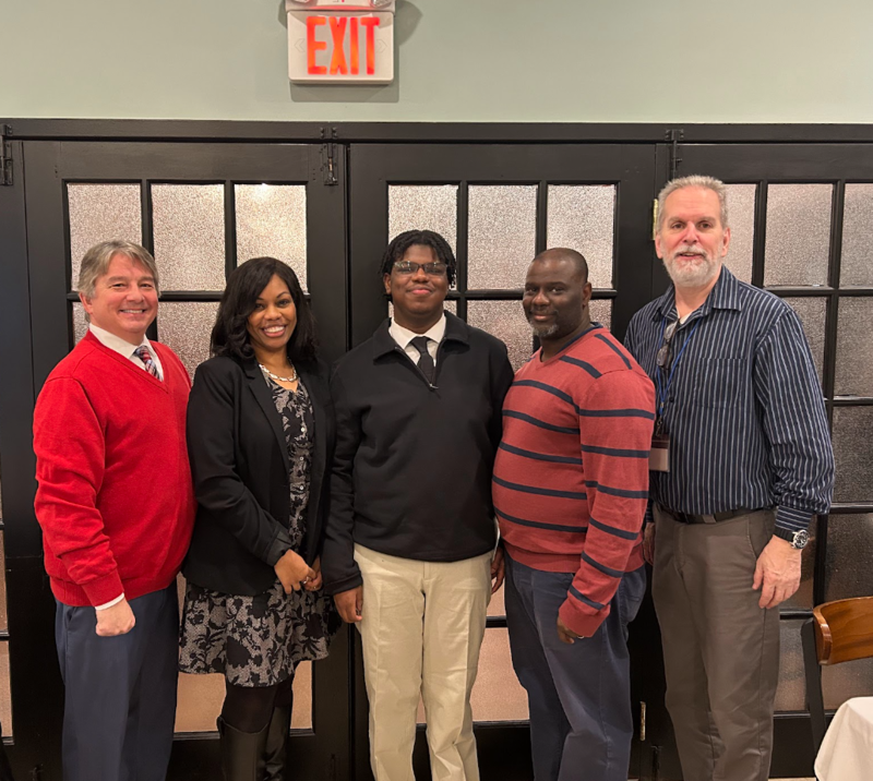 Joshua accepting award