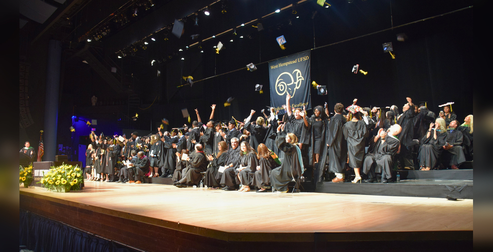 graduation ceremony with graduates celebrating