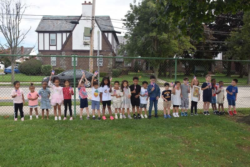 Students standing outside of school.