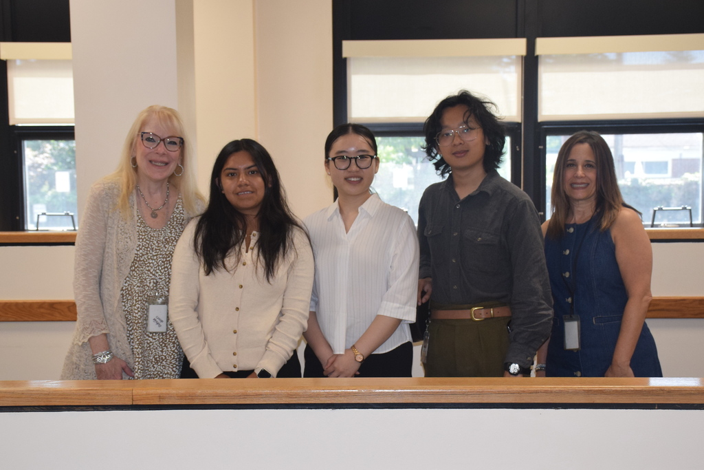 Photo of three Teacher Residency Program scholars with two West Hempstead educators.