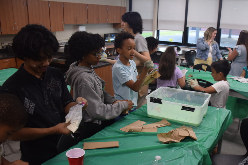 students collaborating in a classroom science experiment