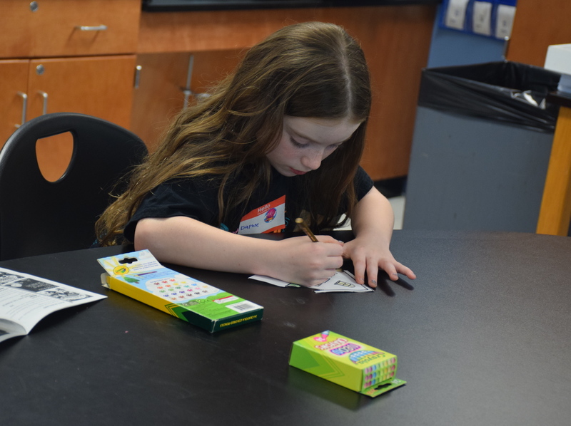 students collaborating in a classroom science experiment