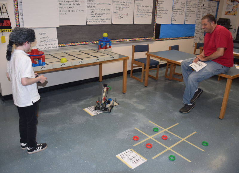 students collaborating in a classroom science experiment