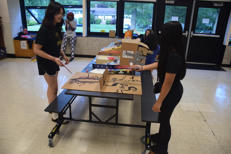 students playing table tennis in cafeteria