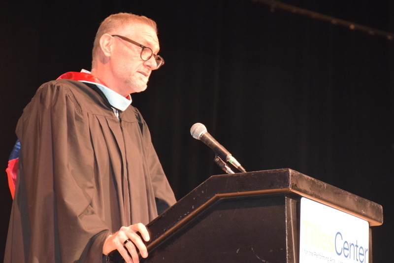 person speaks at podium