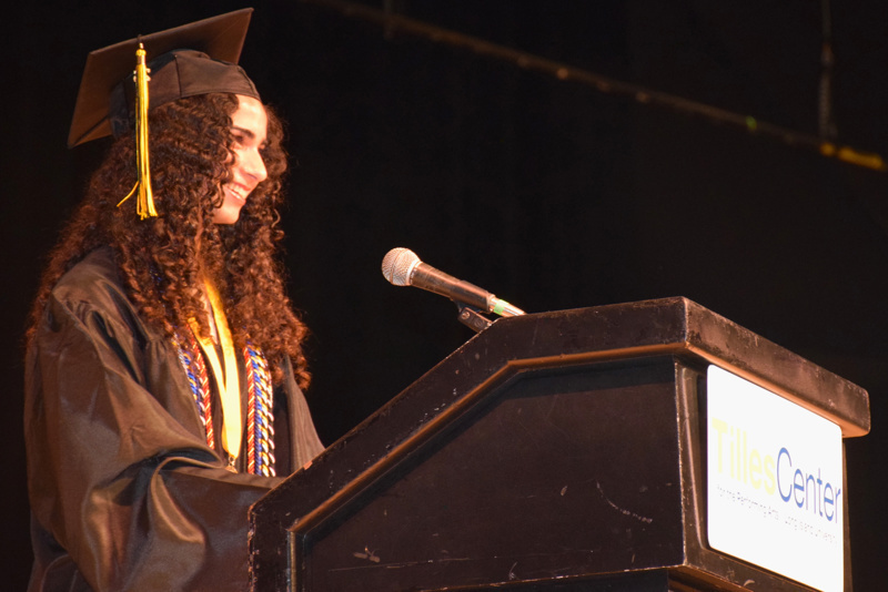 person speaks at podium