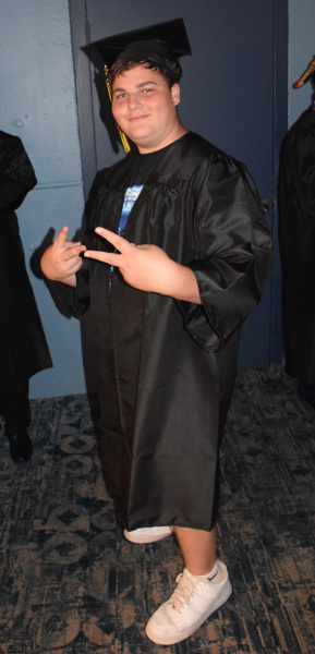 graduate in black cap and gown