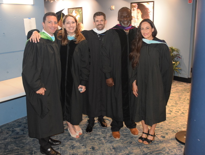 graduates in black caps and gowns
