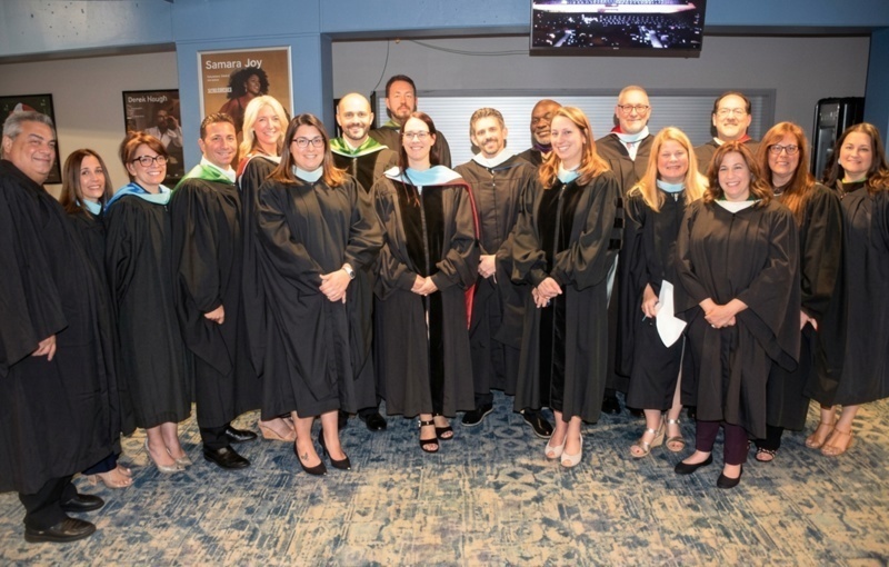 graduates in black caps and gowns