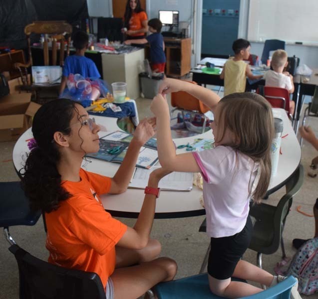 : Students also teamed up to craft sailboats.