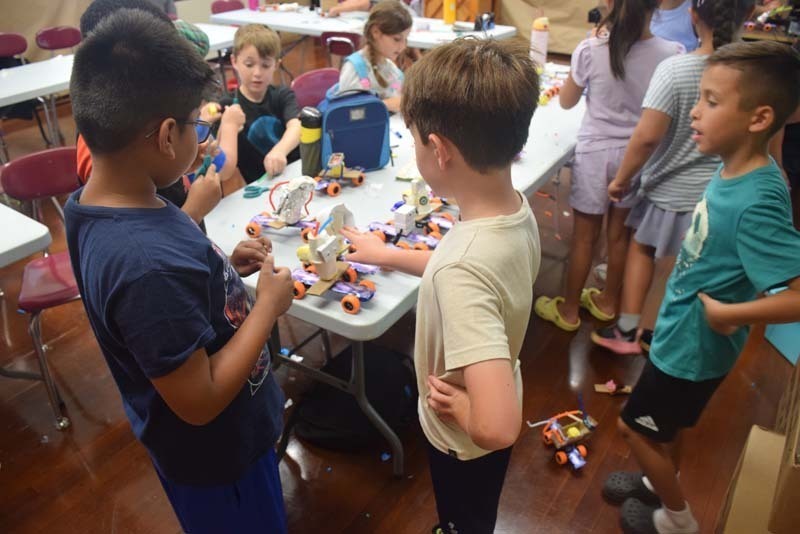 : Students also teamed up to craft sailboats.