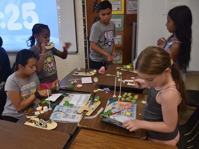 : Students also teamed up to craft sailboats.