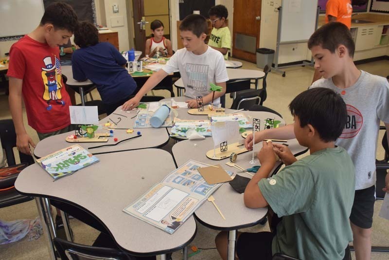 : Students also teamed up to craft sailboats.