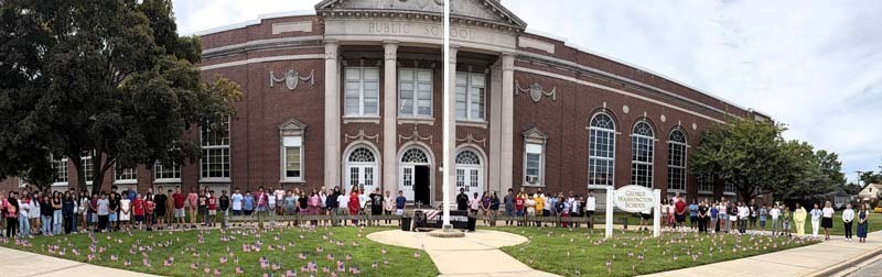 Students standing outside of school.
