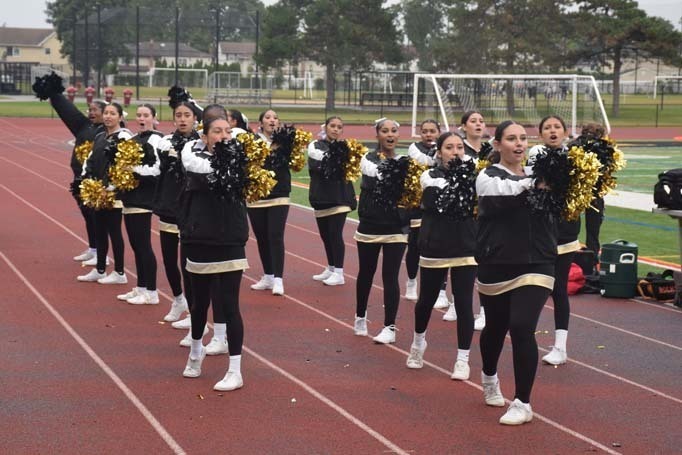 Student cheerleaders on field.