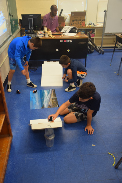 students in classroom and on floor