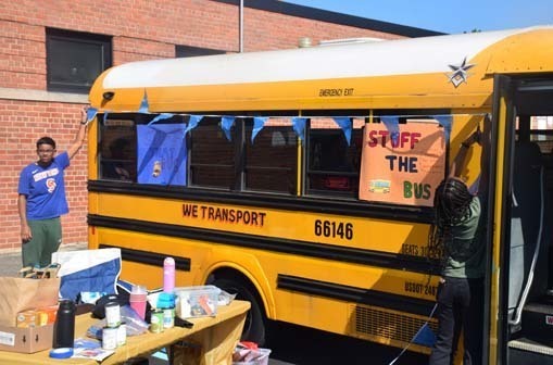 After the parade, secondary school students held a Stuff the Bus food drive to support people in need. 