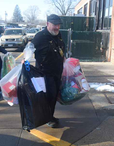 person holding bags of gifts