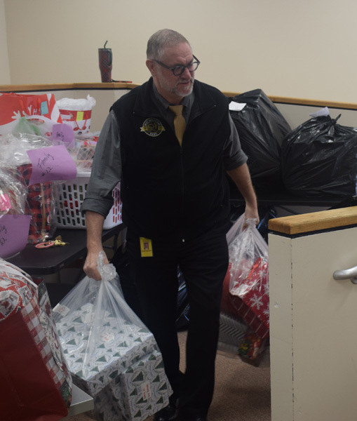 person holding bags of gifts
