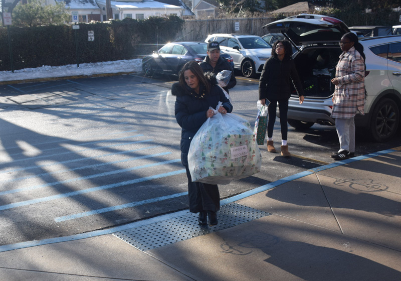 person taking a bag of gifts
