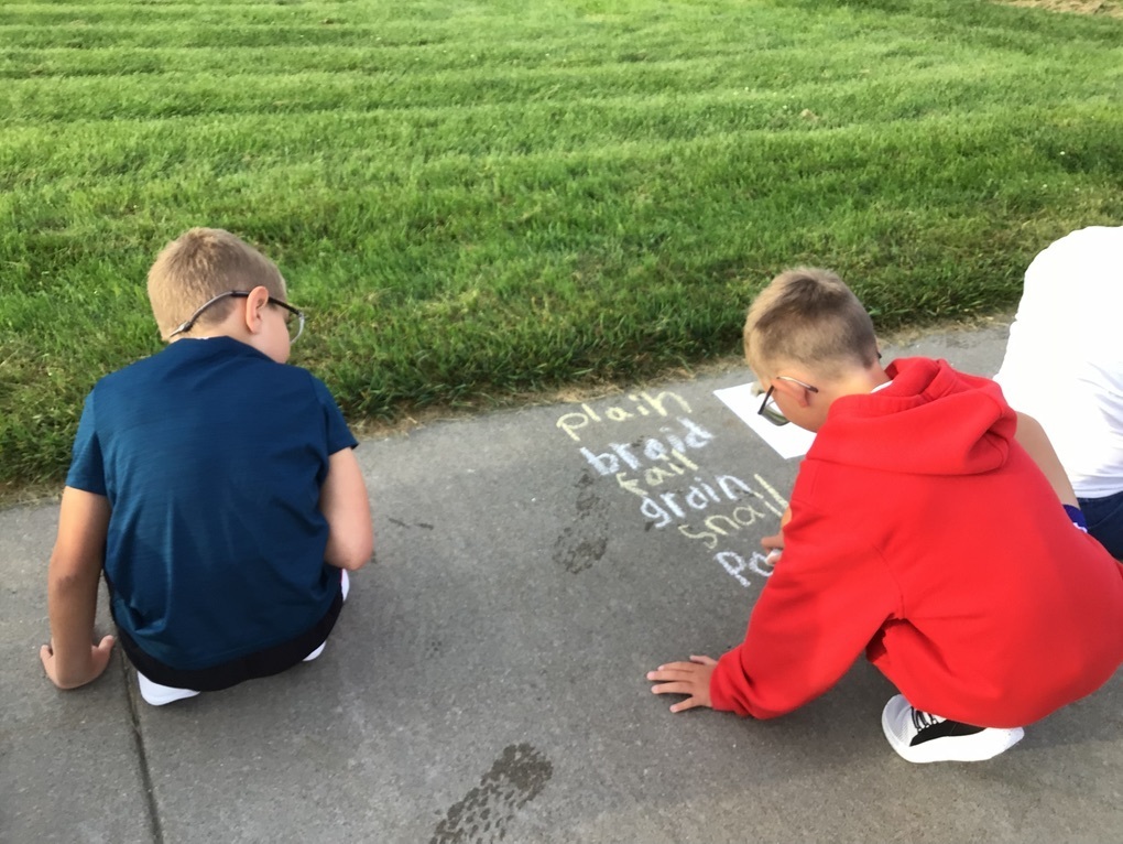 students practicing spelling words
