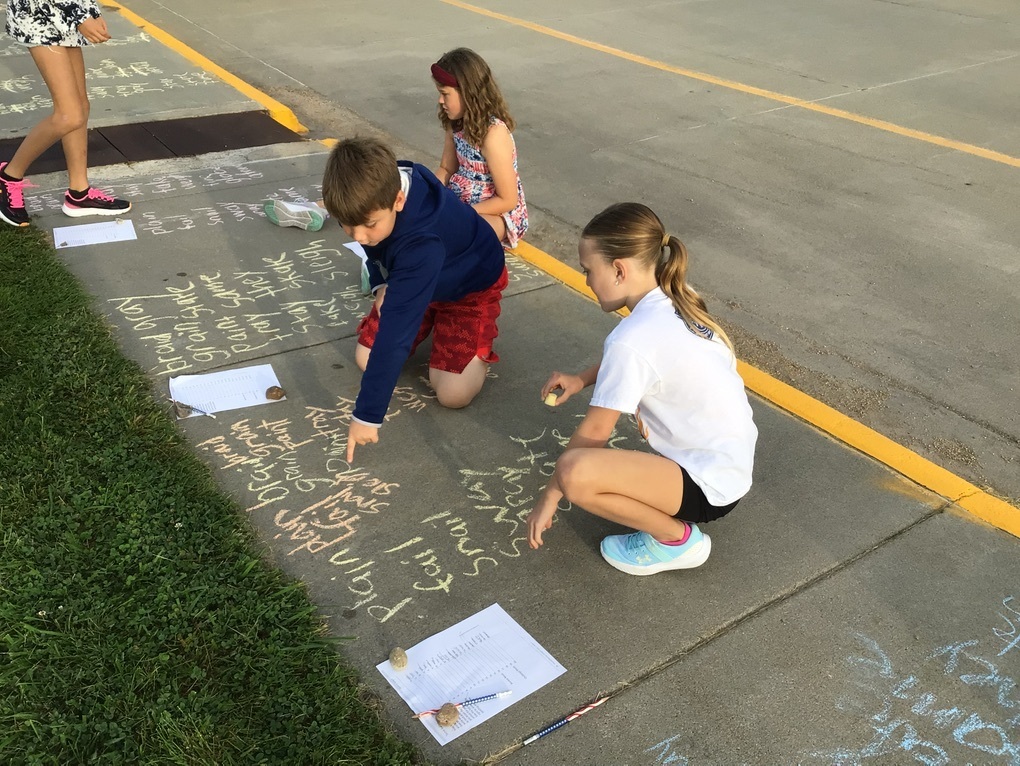 students practicing spelling words