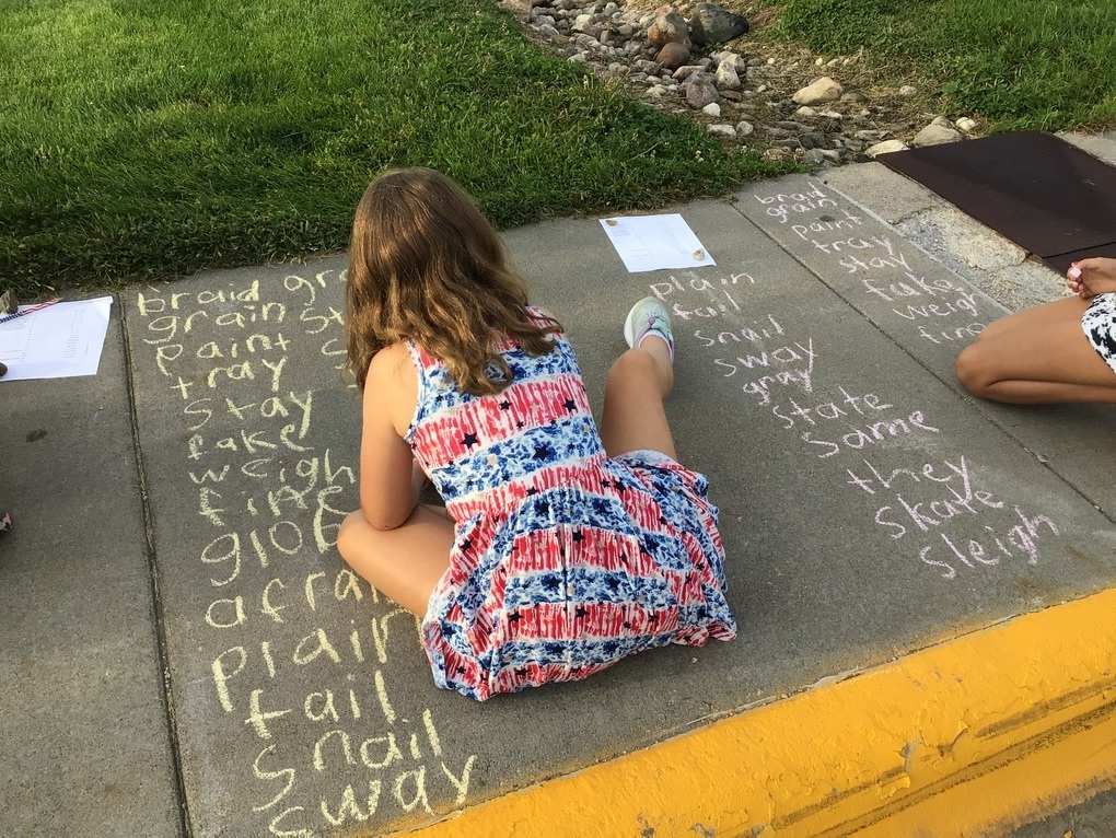 students practicing spelling words
