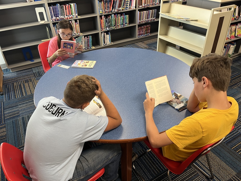 reading at a table